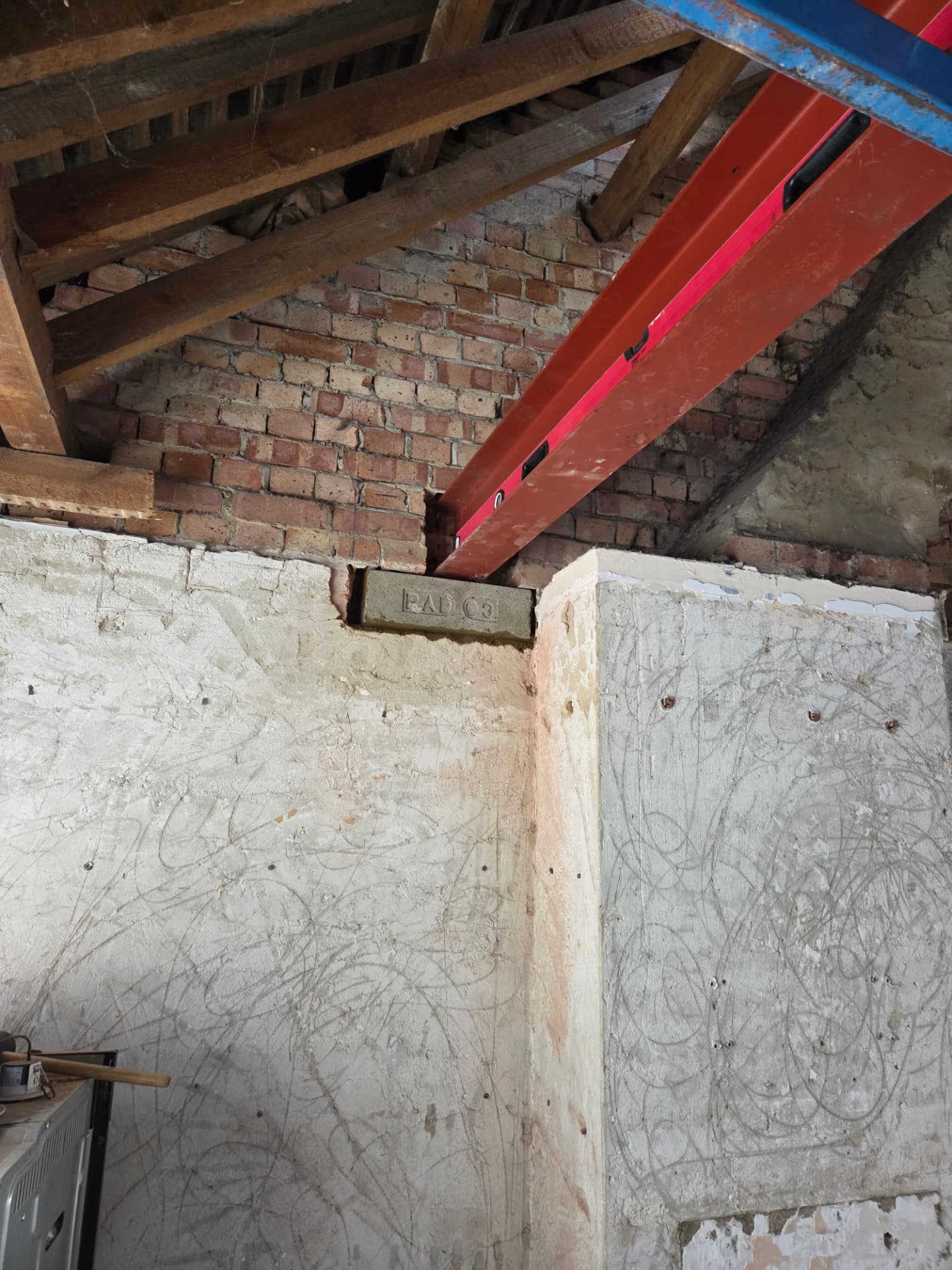 Steel beam landed on a padstone during a structural opening in a brick wall
