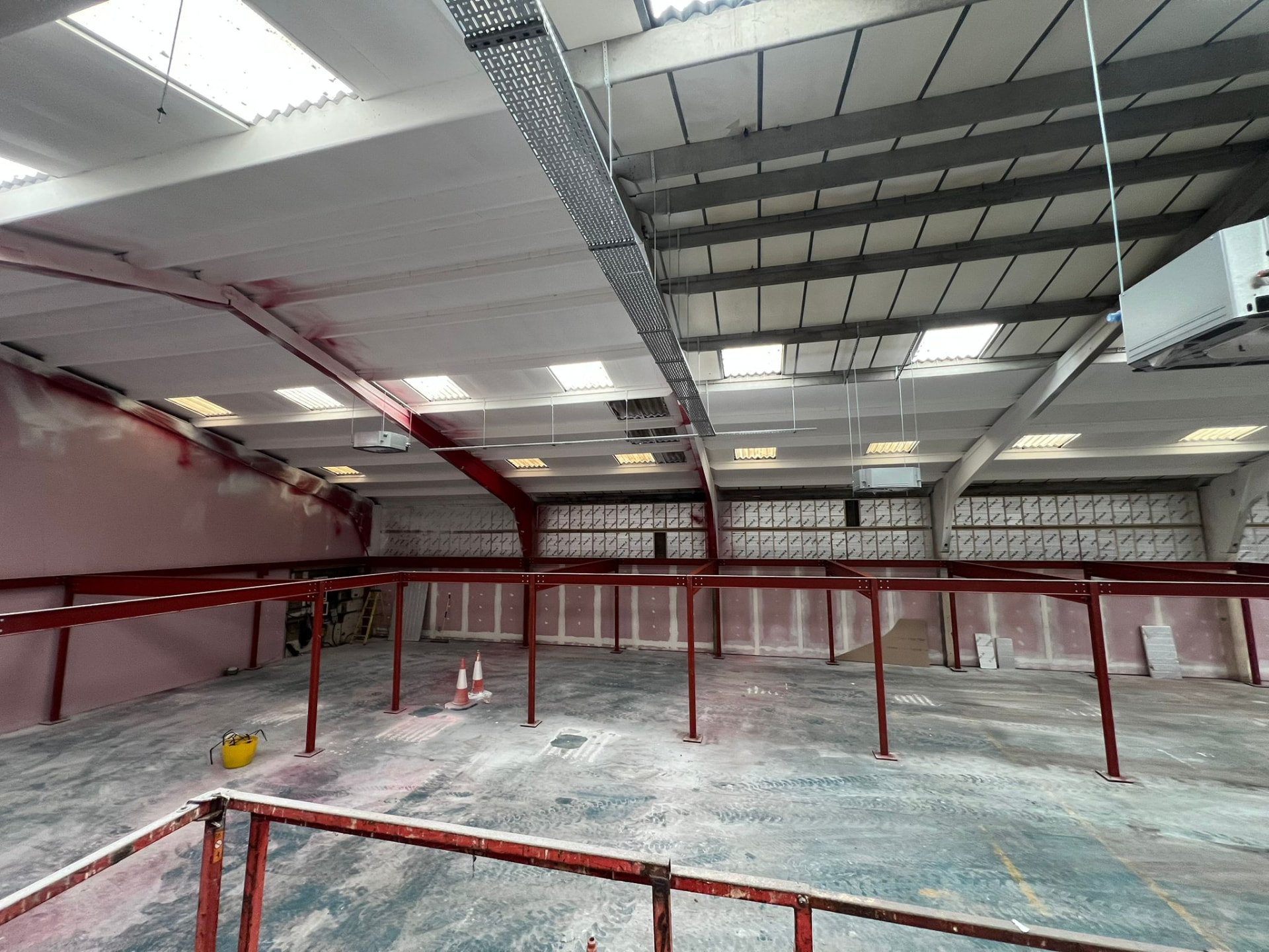 Mezzanine steelwork frame under construction in a warehouse