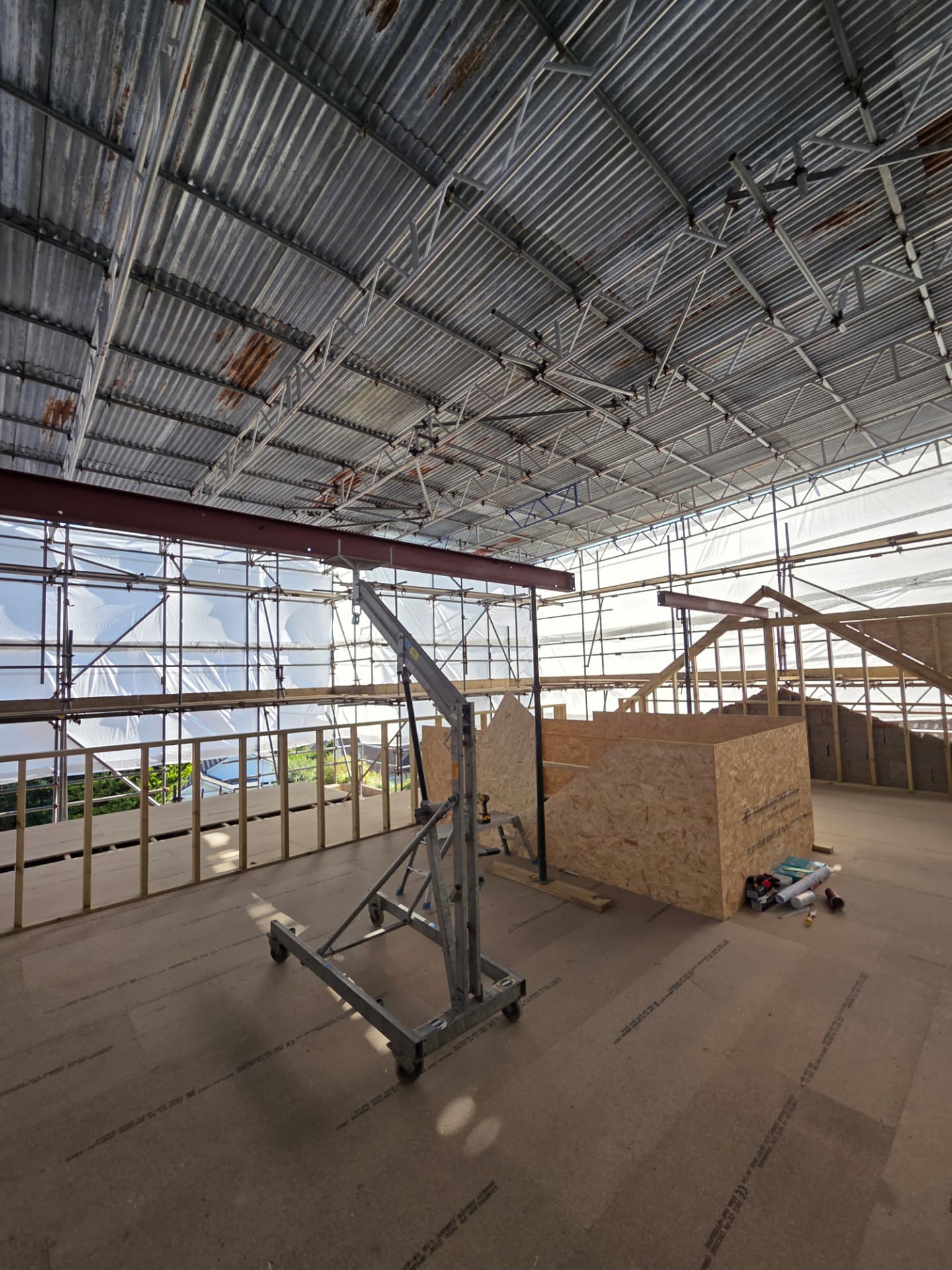 Steel beam installed on a temporary gantry during a loft conversion